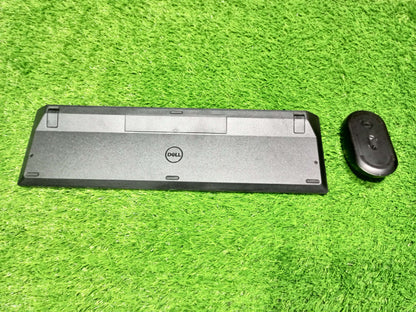 Black electronic device on a green grass background